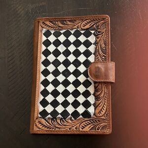 Brown tooled leather wallet with black and white hand painted checkers.